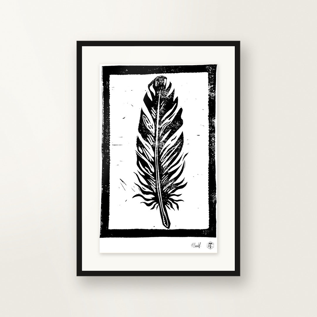 Feather — hand-printed linocut, framed on the wall