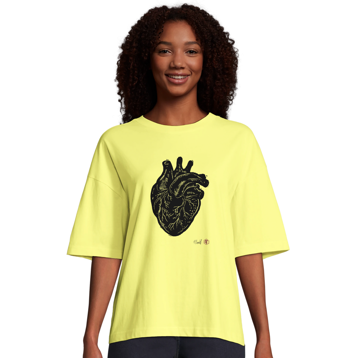 Model wearing T-shirt “Anatomical Heart”, light yellow, women’s cut – front view