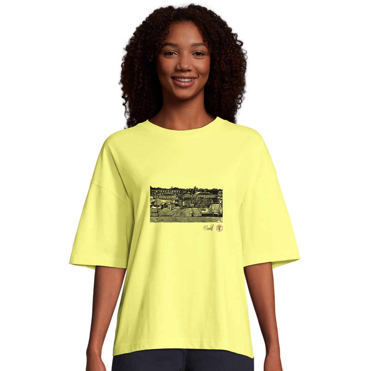 Model wearing T-shirt “The Domes”, light yellow, women’s cut – front view
