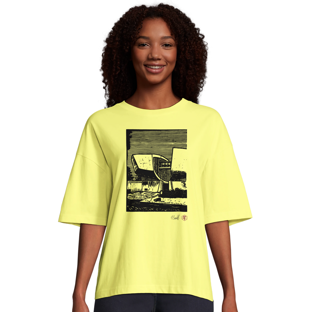 Model wearing T-shirt “SNP”, light yellow, women’s cut – front view