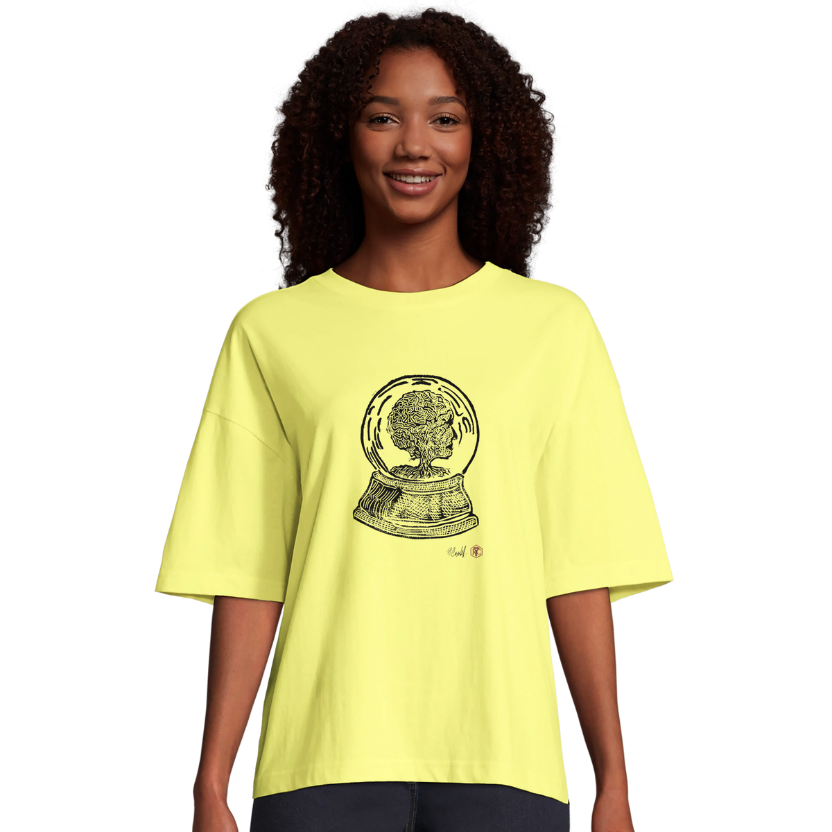 Model wearing T-shirt “Snow Globe Tree”, light yellow, women’s cut – front view