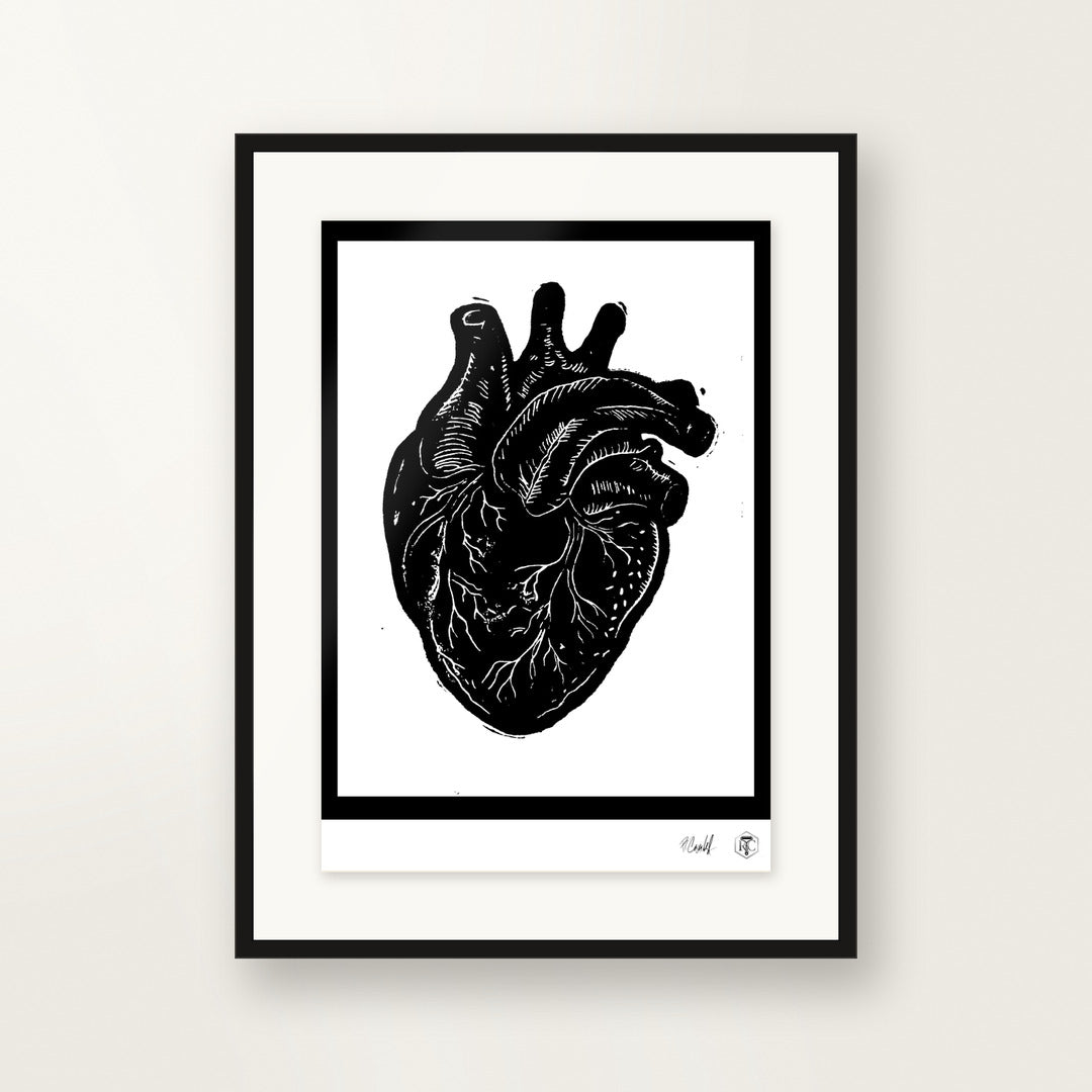 Anatomical Heart — hand-printed linocut, framed on the wall