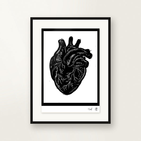 Anatomical Heart — hand-printed linocut, framed on the wall