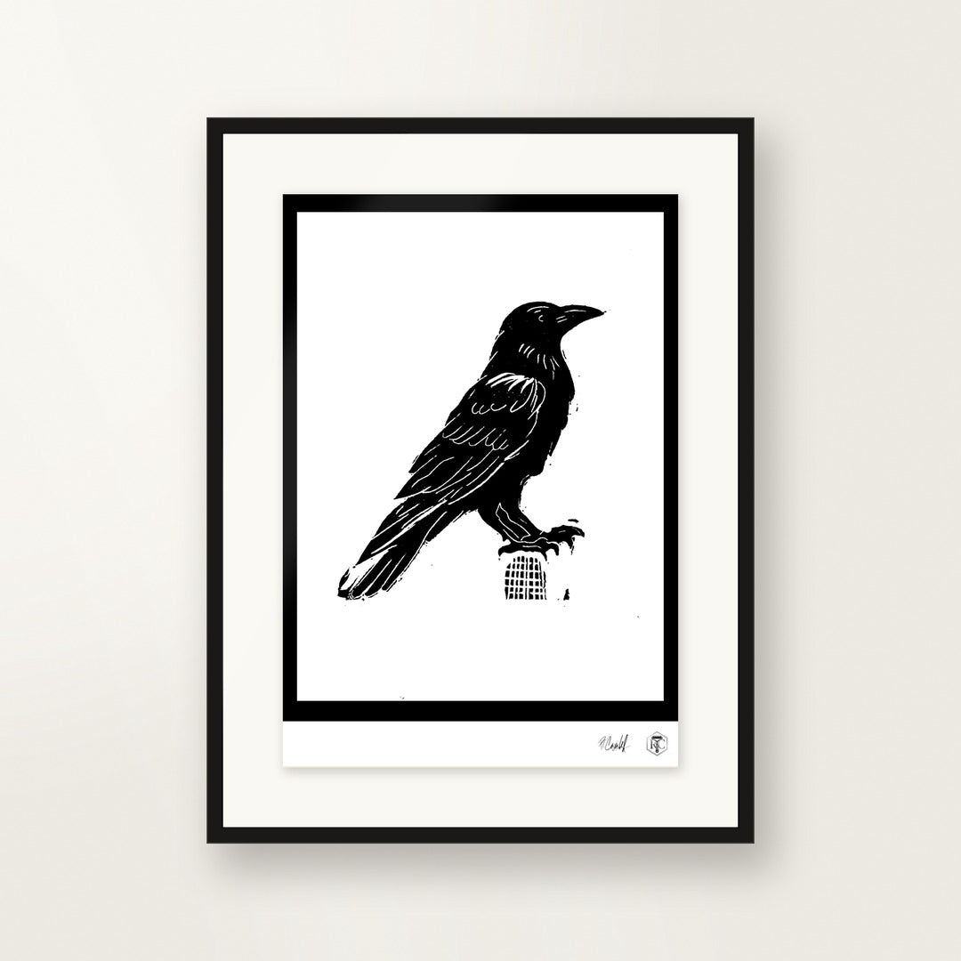 Raven — hand-printed linocut, framed on the wall