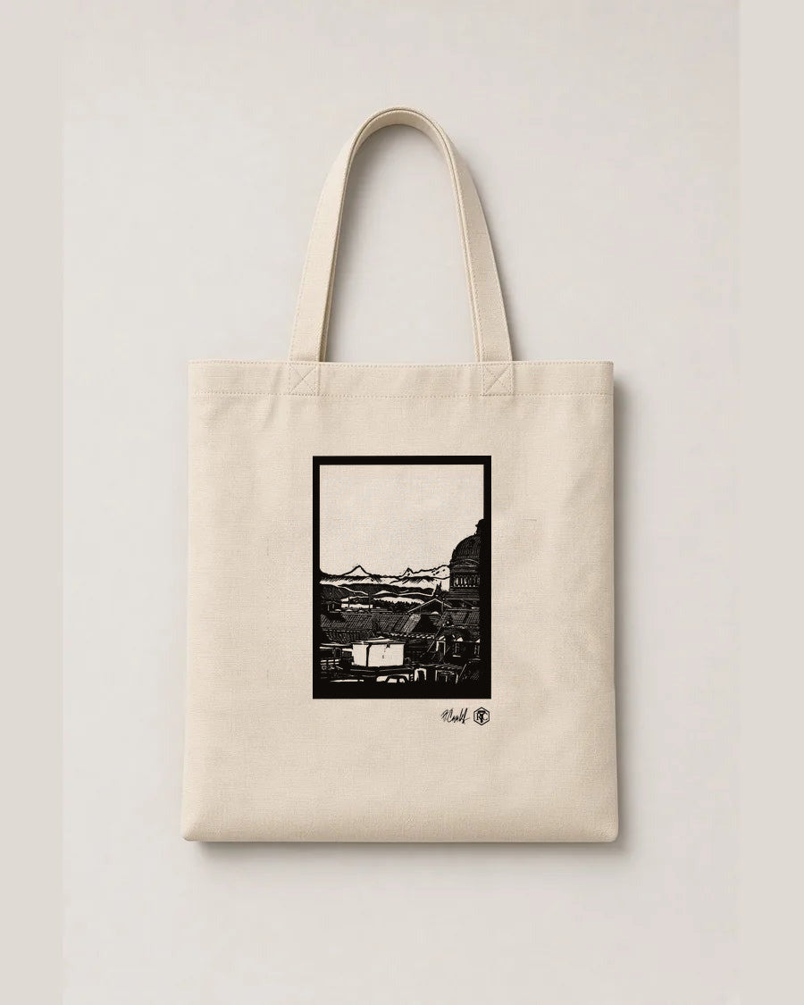 Above Bern — linocut on an organic cotton tote bag, natural colour