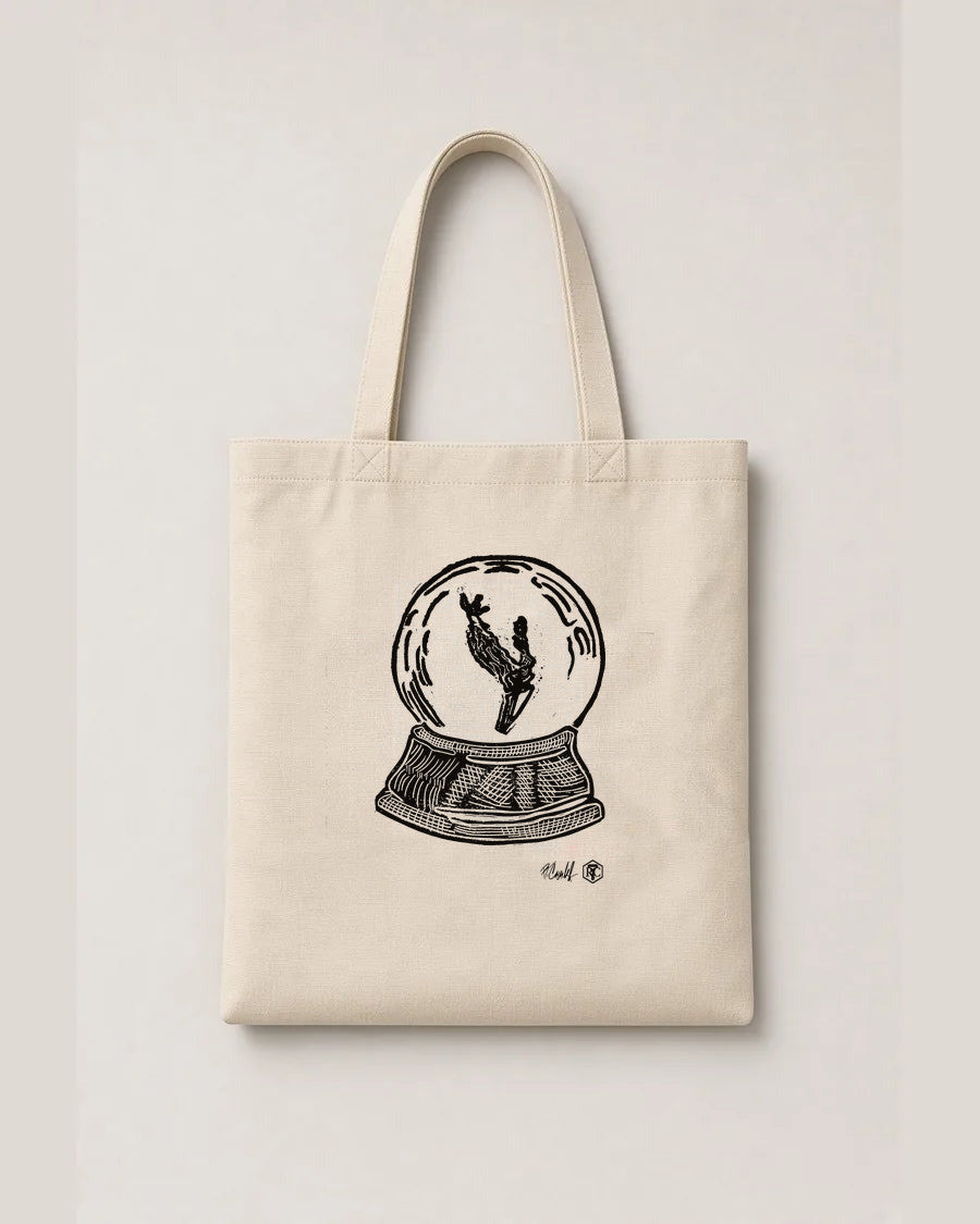 Snow Globe Branch — linocut on an organic cotton tote bag, natural colour